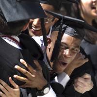 Harvard University Arts and Sciences graduates react as degrees are conferred during 2012 commencement exercises on the school’s campus in Cambridge, Massachusetts. According to a report released Wednesday by the independent Massachusetts Budget and Policy Center, half of all workers in Massachusetts held a bachelor’s degree or higher in 2016, marking the first time a U.S. state has reached that threshold. Massachusetts becomes first state with over 50% of labor force holding at least a bachelor's degree