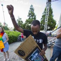 Anti-racism demonstrators pray prior at the start of a rally in Atlanta’s Centennial Olympic Park on Saturday. Protests took place across the country to denounce white supremacists in the wake of the fatal car attack earlier this month in Charlottesville, Virginia. Democrats risk being pulled into culture war