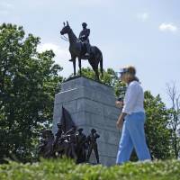 A monument to Gen. Robert E. Lee stands atop a ridge held by Confederate troops above the field of Pickett’s Charge in Gettysburg, Pennsylvania, in this file photo from June 2013. Confederate monuments to stay at Gettysburg battlefield