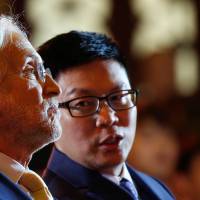 Neil Portnow (left), president of the National Academy of Recording Arts and Sciences, and Bravo Entertainment CEO Steven Fock attend a ceremony in Beijing on Thursday marking the start of a partnership to create the Grammy Festival China. Grammys boss knuckles under China censors as show readies tour