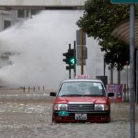 Waves triggered by Typhoon Hato are seen Wednesday in Hong Kong. Hong Kong raises warnings to highest level for severe Typhoon Hato