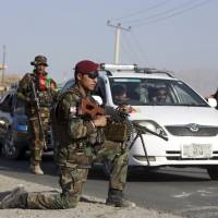 Afghan National army soldiers search a car at a checkpoint on the outskirts of Kabul Monday. On Monday President Donald Trump is planning to deliver his first formal address to the nation since taking office as he reveals to the nation his strategy for the war in Afghanistan. Rocket lands in Kabul diplomatic zone ahead of Trump briefing on Afghan strategy