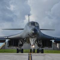 A U.S. Air Force B-1B Lancer assigned to the 37th Expeditionary Bomb Squadron prepares to take off from Andersen Air Force Base, Guam, for a 10-hour mission, flying in the vicinity of Kyushu, the East China Sea and the Korean Peninsula Monday. | RICHARD P. EBENSBERGER / U.S. AIR FORCE / VIA AFP-JIJI