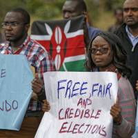 Members of civil society groups protest the killing of electoral commission information technology manager Christopher Msando, at a demonstration in downtown Nairobi Tuesday. Msando, an official crucial to running Kenya’s presidential election next week, was found tortured and killed, the electoral commission chairman said Monday, as concerns grew that the East African nation’s vote again could face dangerous unrest. Kenyans demand probe into torture-slaying of election tech official, fear rigged polls next week