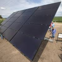 A solar stands on the land of corn farmer Jim Carlson in the proposed path of the Keystone XL pipeline in Silver Creek, Nebraska, on July 29. Keystone XL survived politics, but economics could kill it
