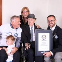 Marco Frigatti, the head of records for Guinness World Records, presents Yisrael Kristal with his certificate as the world’s oldest living man on March 11, 2016. With them are Kristal’s daughter, son and grandchildren. Israeli Holocaust survivor and world's oldest man dies at age 113