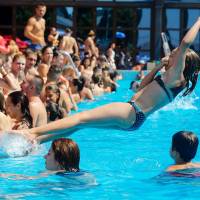 Swimmers crowd a pool in Belgrade on Saturday. Killer 'Lucifer' heat wave stifles large swath of Europe