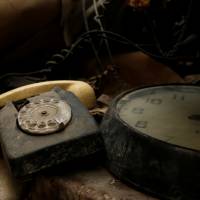 A rotary dial telephone set and clock are seen in the NATO tunnels dating back to the Cold War in the War Headquarters tunnels beneath Valletta in March. | REUTERS