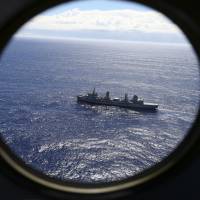 The HMAS Success scans the southern Indian Ocean, near the coast of Western Australia, as a Royal New Zealand Air Force P3 Orion flies over, while searching for missing Malaysia Airlines Flight MH370 in 2014. Scientists have potentially narrowed the search area for the missing Malaysian airliner to three specific locations in the southern Indian Ocean, through new satellite and drift analysis of the 2014 crash released Wednesday. Aussie agencies, with help of satellite drift data, pinpoint 'most-likely' location of MH370