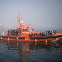 Migrants arrive on board a Spanish maritime rescue boat at the port of Tarifa, southern Spain, after being rescued in the Strait of Gibraltar Wednesday. Spain’s maritime rescue service has saved more than 600 migrants trying to cross the Mediterranean Sea from Morocco in the past 24 hours, making it one of its busiest days so far this year. Spain rescues over 600 migrants coming from Morocco by sea in 24 hours
