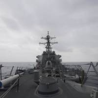 This photograph, taken by the U.S. Navy and obtained Thursday, shows the guided-missile destroyer USS John S. McCain patrolling in the South China Sea in January. The ship on Thursday sailed close to an artificial island China has built up in the South China Sea as part of a \"freedom of navigation\" operation, an official said. The McCain sailed within 12 nautical miles of Mischief Reef. | JAMES VAZQUEZ / U.S. NAVY / VIA AFP-JIJI