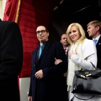 Then-U.S. Treasury Secretary nominee Stephen Mnuchin and his fiancee, Louise Linton, arrive for the presidential inauguration of Donald Trump at the U.S. Capitol on Jan. 20. U.S. Treasury chief's actress wife apologizes over Instagram post tagging her pricey clothes