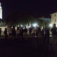Onlookers watch as Confederate statues are removed from the south mall of the University of Texas in Austin, Texas, Monday. Poll split along racial, party lines finds 54% feel Confederate monuments should be preserved