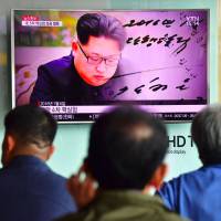 People watch a television news report showing file footage of North Korean leader Kim Jong Un, at a railway station in Seoul last September. Little evidence latest sanctions can halt North Korea's nuclear march