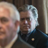 Senior White House adviser Steve Bannon (back) attends a meeting at the White House in Washington in March. Trump adviser Bannon open to withdrawing U.S. troops from South Korea if North freezes nuclear program