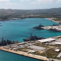 U.S. Navy vessels are moored in port at the U.S. naval base at Apra Harbor, Guam, in March 2016. | NAVAL BASE GUAM / VIA REUTERS
