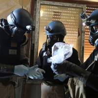 United Nations chemical weapons experts collect samples from the site of an alleged chemical weapons attack in the Ain Tarma neighborhood of Damascus, Syria, in August 2013. Shipments from North Korea to Syria's chemical arms agency intercepted: U.N. report