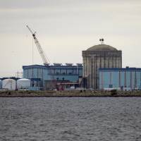 Unit 1 of the V.C. Summer Nuclear Station stands beside the Monticello Reservoir near Jenkinsville, South Carolina, on Sept. 21. South Carolina’s utilities are abandoning two partly built nuclear reactors and want to charge customers another $5 billion to cover their costs — money that an environmentalist says could have gone to renewable energy. Billions lost in U.S. nuclear power projects, with more bills due