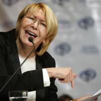 Venezuela’s ousted Chief Prosecutor Luisa Ortega Diaz gives a press conference in July in Caracas. Immigration authorities in Colombia announced Tuesday that Ortega Diaz is on her way to Brazil. Ortega said that Venezuelan President Nicolas Maduro removed her in order to stop a probe linking him and his inner circle to nearly $100 million in bribes from Brazilian construction company Odebrecht. Venezuela's ousted attorney general leaves Colombia for Brazil