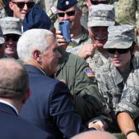 U.S. Vice President Mike Pence greets U.S. troops taking part in NATO-led joint military exercises Noble Partner 2017 at the Vaziani military base near Tbilisi Tuesday. Pence hits Russia's 'occupation' of Georgia territory during visit
