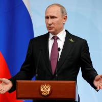 Russian President Vladimir Putin speaks during a news conference after the Group of 20 nations’ summit on July 8 in Hamburg, Germany. Fragile economy stays Putin's hand in standoff with U.S.