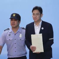 Jay Y. Lee, Samsung Group heir, leaves after hearing his verdict at the Seoul Central District Court in Seoul on Friday. He was sentenced to five years in prison, while prosecutors had sought 12 years. Samsung scion Jay Y. Lee appeals five-year prison term for bribery