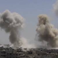 This frame grab from video provided on Sunday by the Ghouta Media Center, a Syrian activist media group, shows smoke and debris rising after Syrian government ground-to-ground rockets strike the opposition-held town of Ain Terma, in the Eastern Ghouta suburb of Damascus on Saturday. Syria regime seen doubling territory it controls after pushing back Islamic State with Russia's help