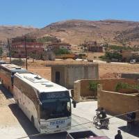 A convoy carrying Syrian jihadis and their families, who have been in eastern Lebanon since the beginning of the Syria war, enter the Lebanese Wadi al-Hamid area, in the Jurud Arsal border region, to be transported to Syria’s northwestern province of Idlib, as part of the second phase of a cease-fire deal Monday. Lebanon’s Hezbollah’s “War Media” outlet reported that the “first phase of the deal” took place on Sunday where “the bodies of nine Al-Nusra fighters were exchanged for the remains of five Hezbollah fighters who died in the Jurud battles.” Thousands of Syria jihadis, refugees to leave Lebanon border zone in swap with Hezbollah prisoners