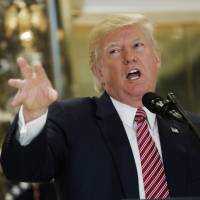 President Donald Trump speaks to reporters in the lobby of Trump Tower in New York on Tuesday, saying “there is blame on both sides” for the violence at a white nationalist rally in Charlottesville and that there were “very fine people” on both sides. Trump's crisis over response to hate groups spurs talk of White House departures