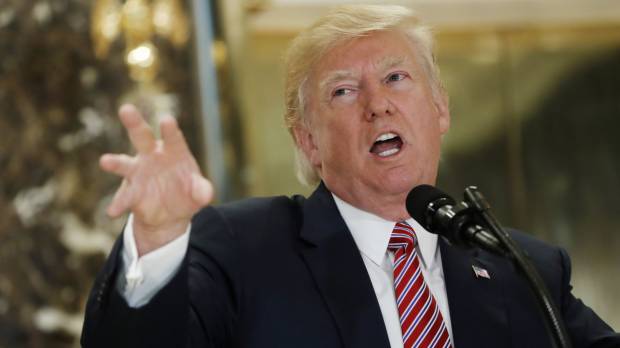 President Donald Trump speaks to reporters in the lobby of Trump Tower in New York on Tuesday, saying “there is blame on both sides” for the violence at a white nationalist rally in Charlottesville and that there were “very fine people” on both sides. Trump's crisis over response to hate groups spurs talk of White House departures