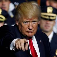 U.S. President Donald Trump speaks during a gathering of federal, state and local law enforcement officials on Friday in Brentwood, a hamlet on Long Island in New York state. Senate Republicans begin abandoning Trump