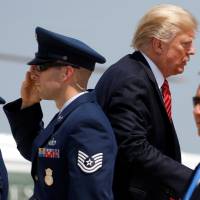 U.S. President Donald Trump is saluted as he boards Air Force One before departing for Arizona from Joint Base Andrews, Maryland, Tuesday. Trump to revisit immigration issue with Arizona border tour, rally but GOP senators to be absent