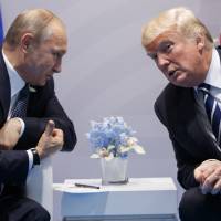 President Donald Trump meets with Russian President Vladimir Putin at the G-20 Summit in Hamburg, Germany, on July 7. | AP