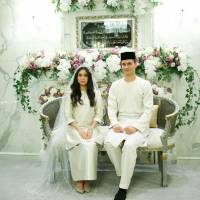Dennis Muhammad Abdullah of the Netherlands poses with his bride, Princess Tunku Tun Aminah Sultan Ibrahim, the only daughter of the Sultan of Johor, after their wedding on Monday at Istana Bukit Serene in Johor Bahru, Malaysia. Malaysian princess marries Dutchman in lavish ceremony