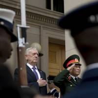 U.S. Defense Secretary Jim Mattis and Vietnam Defense Minister Gen. Ngo Xuan Lich participate Tuesday in an enhanced honor cordon at the Pentagon. Hanoi secures first visit by U.S. carrier since Vietnam War, greater defense cooperation, as tensions build with China
