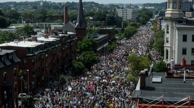 A large crowd marches toward Boston Commons to protest the Boston Free Speech Rally in the city on Saturday. Boston counterprotest overwhelms, cuts short 'free speech rally'