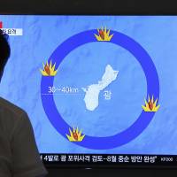 A TV screen at Seoul Station broadcasts a news program on North Korea’s threats to strike Guam with ballistic missiles on Thursday. Xi urges Trump to avoid exacerbating tensions with North Korea