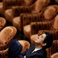 Prime Minister Shinzo Abe shuts his eyes during a Lower House committee session in February 2015. Abe's dream of amending Constitution slipping away