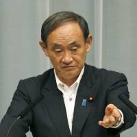 Chief Cabinet Secretary Yoshihide Suga speaks at a news conference Tuesday at the Prime Minister’s Office. Japan protests Chinese activity near Senkaku Islands in gas-rich East China Sea