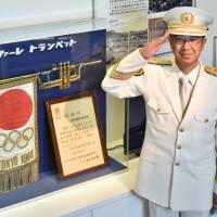 Kazuyuki Yoneda, head of Aichi Prefectural Police band, poses next to a trumpet that was used during the 1964 Tokyo Olympics. Aichi police proudly displaying trumpet from 1964 Tokyo Olympics