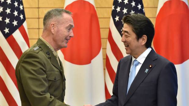 Gen. Joseph Dunford, chairman of the U.S. Joint Chiefs of Staff, shakes hands with Prime Minister Shinzo Abe at Abe’s official residence in Tokyo on Friday. Top U.S. general reaffirms commitment to Japan amid North Korea tensions