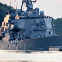 The U.S. Navy Arleigh Burke-class guided-missile destroyer USS Fitzgerald returns to Fleet Activities (FLEACT) Yokosuka following a collision with a merchant vessel while operating southwest of Yokosuka, Kanagawa Prefecture, on June 17. Skipper to be relieved of command, sailors face punishment over U.S. warship collision off Japan