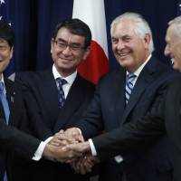 Showing solidarity (from left) Defense Minister Itsunori Onodera, Foreign Minister Taro Kono, Secretary of State Rex Tillerson and Defense Secretary James Mattis do an “ASEAN style” handshake at the start of a Security Consultative Committee meeting, Thursday at the State Department in Washington. U.S.-Japan vow unity against North in 'two-plus-two' talks