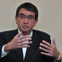 Newly appointed Foreign Minister Taro Kono speaks during a joint interview on Tuesday in Tokyo. Kono warns of 'loopholes' in North Korea sanctions, urges strict implementation
