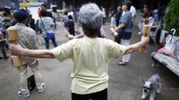 A woman exercises in Tokyo in September 2016. Kyoto Prefectural University of Medicine and Hirosaki University will launch a survey in the Tango district in northern Kyoto Prefecture to study the longevity of residents there. Universities in Kyoto, Aomori to probe contrasting longevity