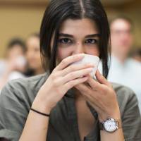 Zeynep Arican drinks a cup of Japanese tea during Mitsubishi UFJ Financial Group Inc.’s global analyst program at Happo-en garden in Tokyo on July 17. In bid to go global, MUFG woos overseas talent