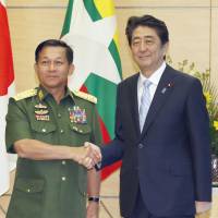 Prime Minister Shinzo Abe meets Myanmar\'s Senior Gen. Min Aung Hlaing at the Prime Minister\'s Office on Friday. | KYODO