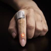 Electric current from a battery placed near the knuckle flows through the conductor and powers an LED near the fingertip. Japan's scientists develop superthin nano sensors that may be the next big advance in wearable tech