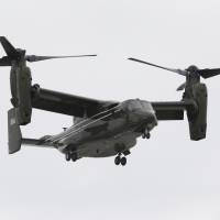 A U.S. Marine Corps MV-22 Osprey comes in for a landing at Miami International Airport before a presidential visit to Florida on April 22, 2015. Three U.S. Marines were missing after their Osprey crashed into the sea off the east coast of Australia on Saturday. ap Aussie navy locates wreck of U.S. Osprey; marines still missing