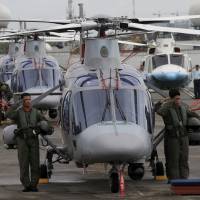 Philippine Air Force pilots stand next to newly acquired AgustaWestland AW109E helicopters during a ceremony at Villamor Air Base in Manila in December 2015. Japan said to offer chopper parts to Philippines as counter to China